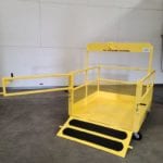 Custom 1/2 Ramp Single Pick with Casters and Brakes. Front view, open gate and ramp