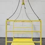 Front view of industrial yellow material platform rated for 2000 lbs, designed for lifting with a spreader bar and overhead suspension system.