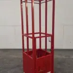 Compact red crane-suspended man basket with fully enclosed frame, single pick point, and 24x24 inch footprint for tight-access construction work.