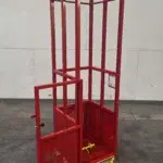 Engineered man basket with open door, interior grab rail, and internal test weight pin, designed for safe crane lifting in restricted environments.