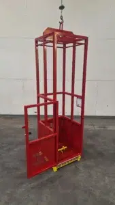 Engineered man basket with open door, interior grab rail, and internal test weight pin, designed for safe crane lifting in restricted environments.